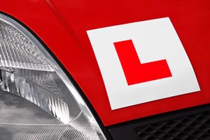 L Plate On Red Car